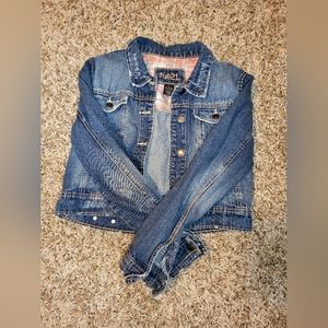 -Ripped style blue jean jacket-cropped waist-size large, fits like a medium